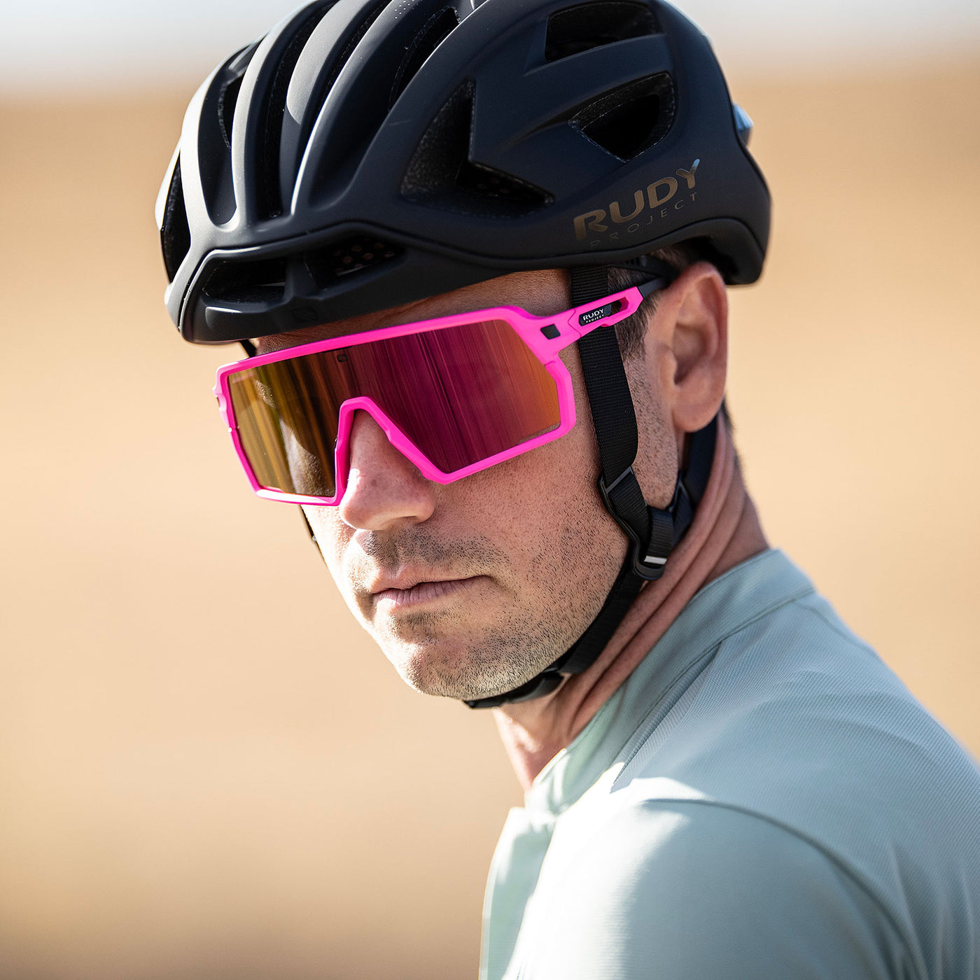 Rudy Project Kelion sport sunglasses are perfect for all outdoor activities including running, cycling, gravel biking, mountain biking, golf and pickleball#color_kelion-crystal-red-with-multilaser-red-lenses